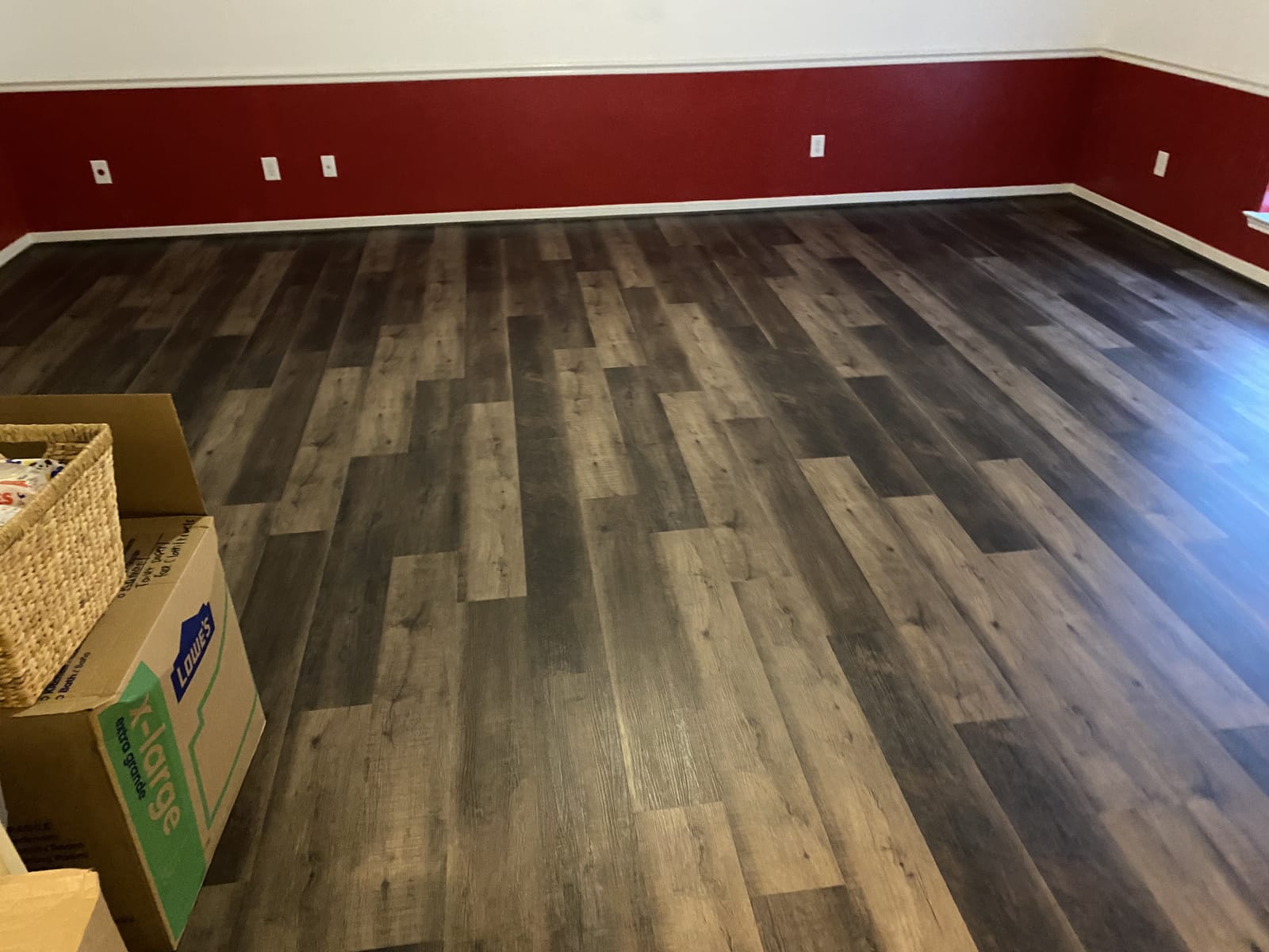 Luxury vinyl plank running through a bold accent room