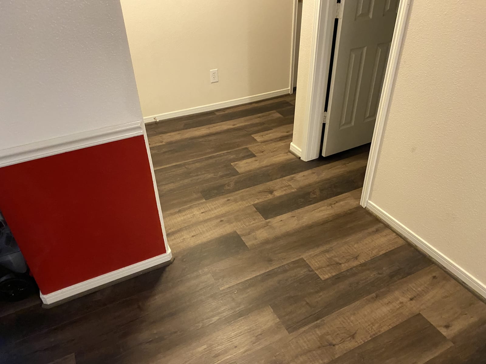 Wood-look vinyl plank across a whole first floor