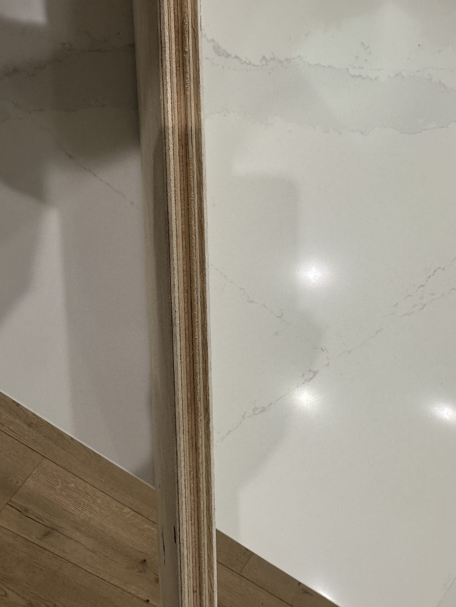 Quartz slab feature wall with wall sconces