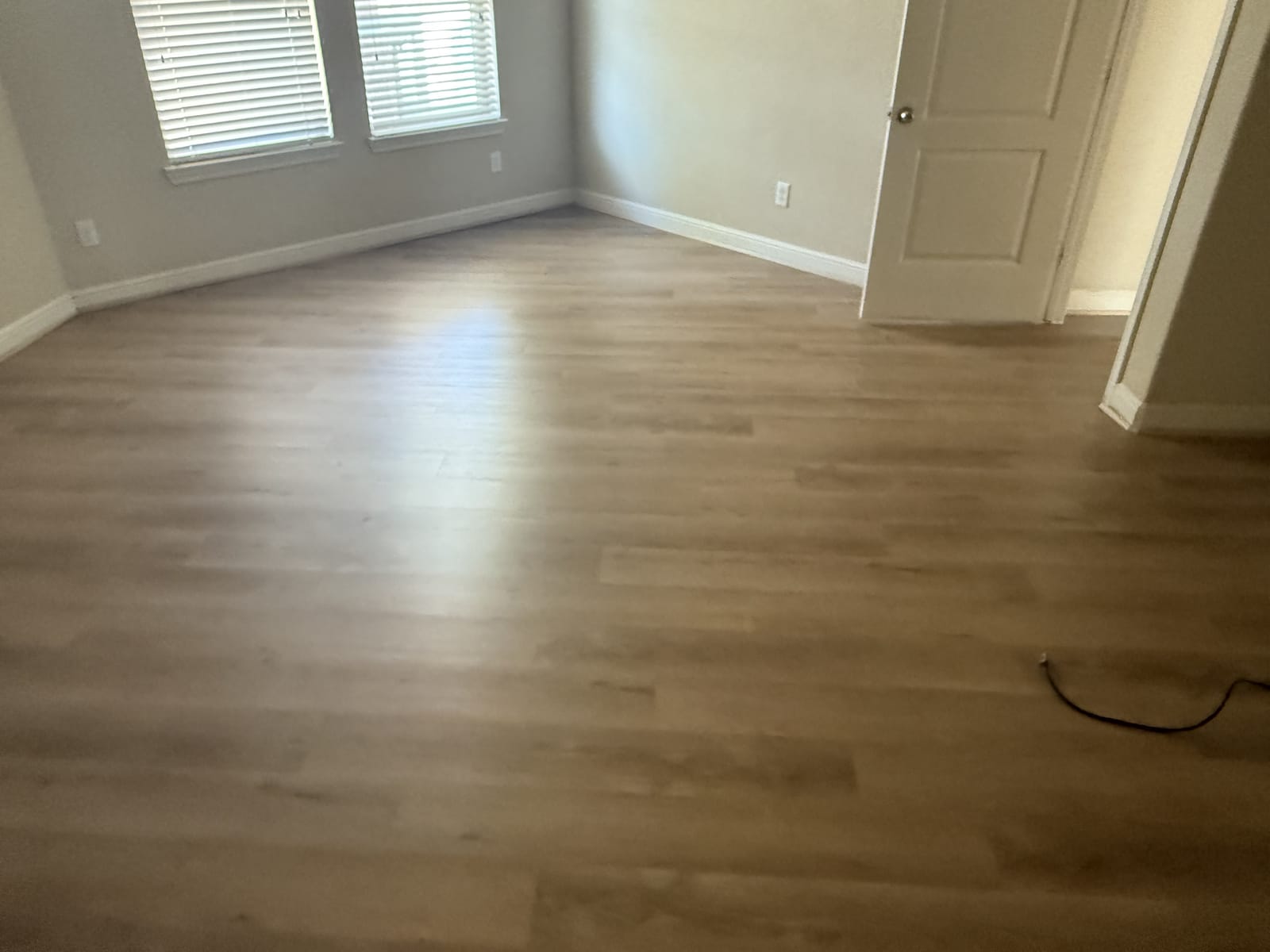 Gray plank through a bright, open room